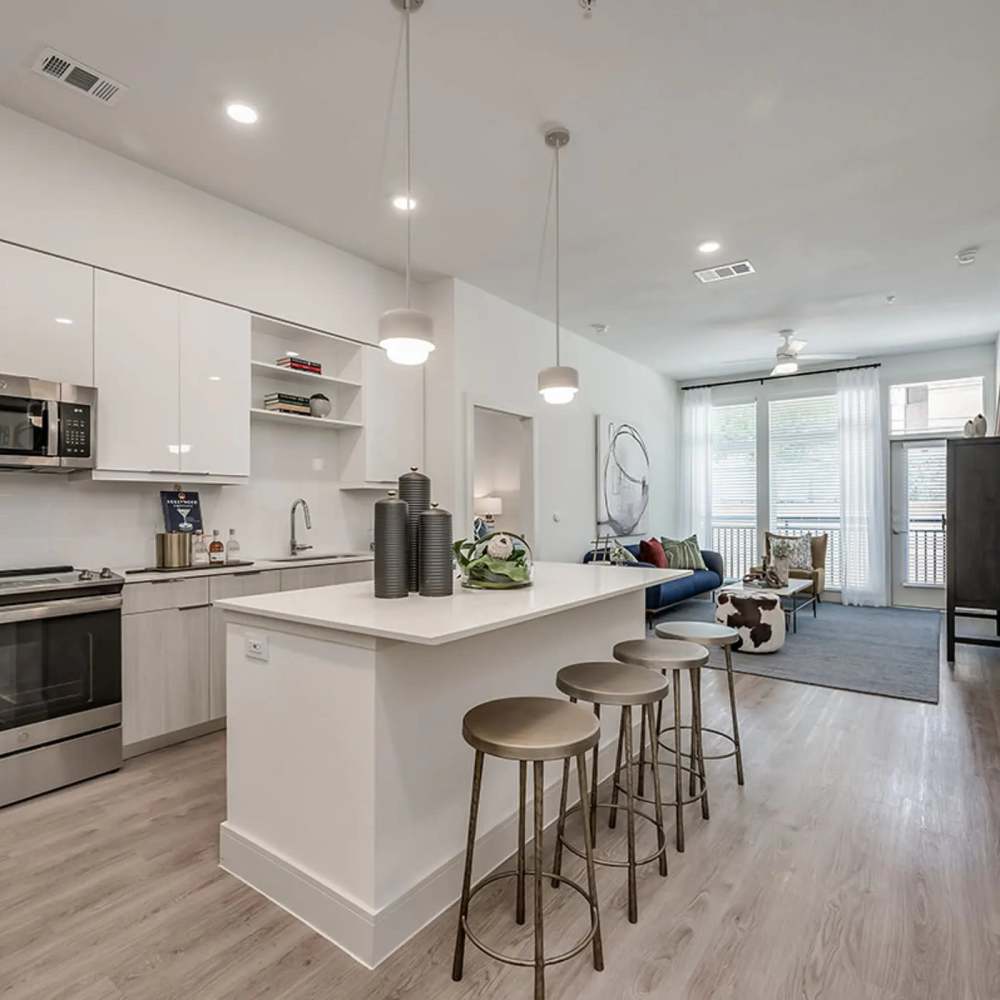 Dining and living area of an apartment home at Revl Med Center in Houston, Texas