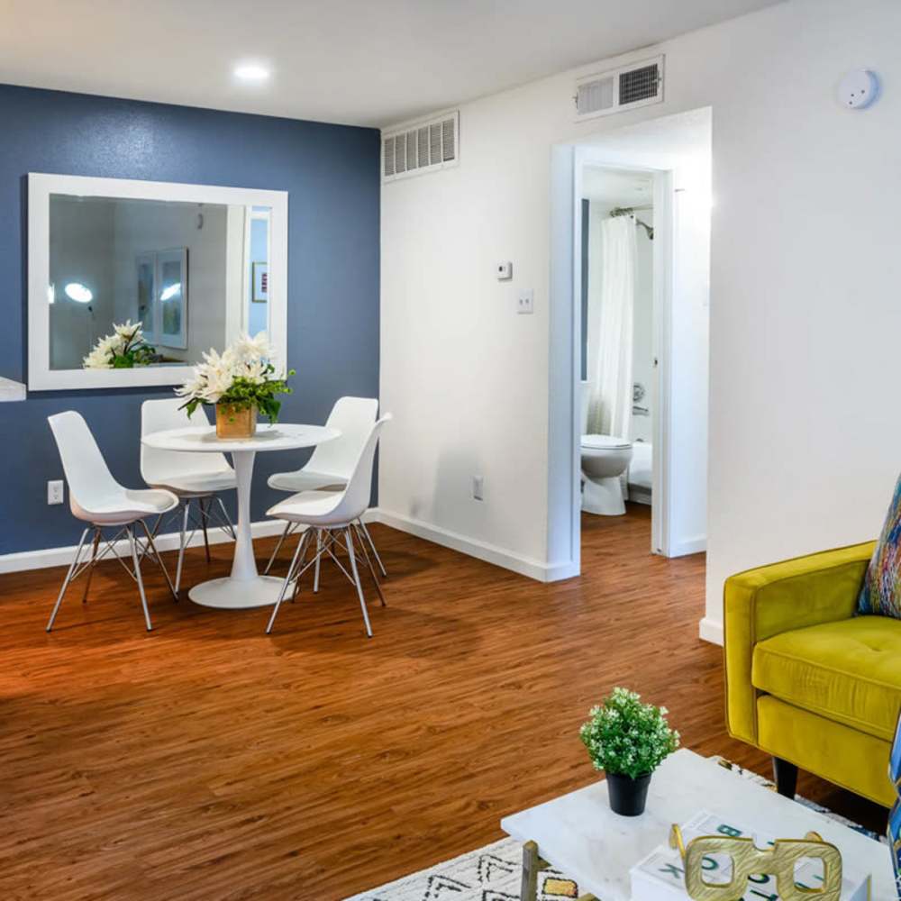 Dining and living area of an apartment home at The Daphne in Houston, Texas