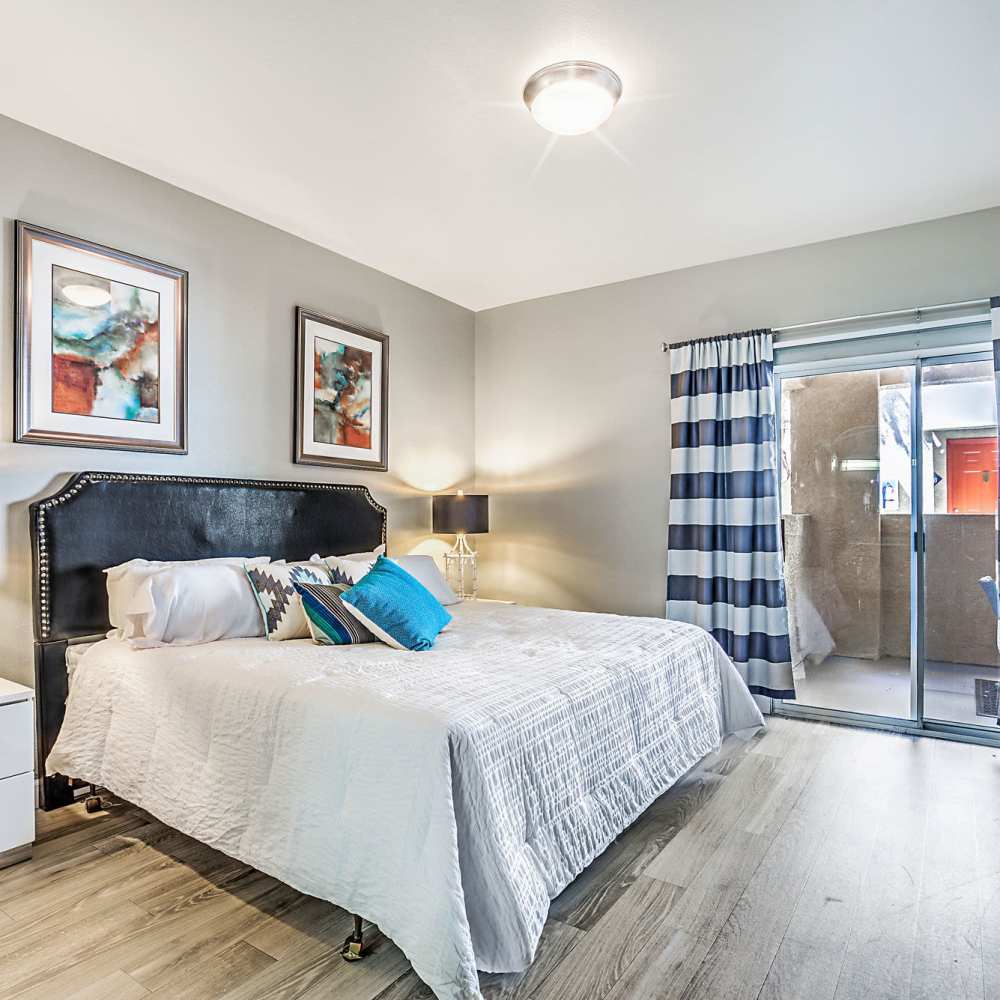 Bedroom with access to the patio or balcony at Calypso Apartments in Las Vegas, Nevada