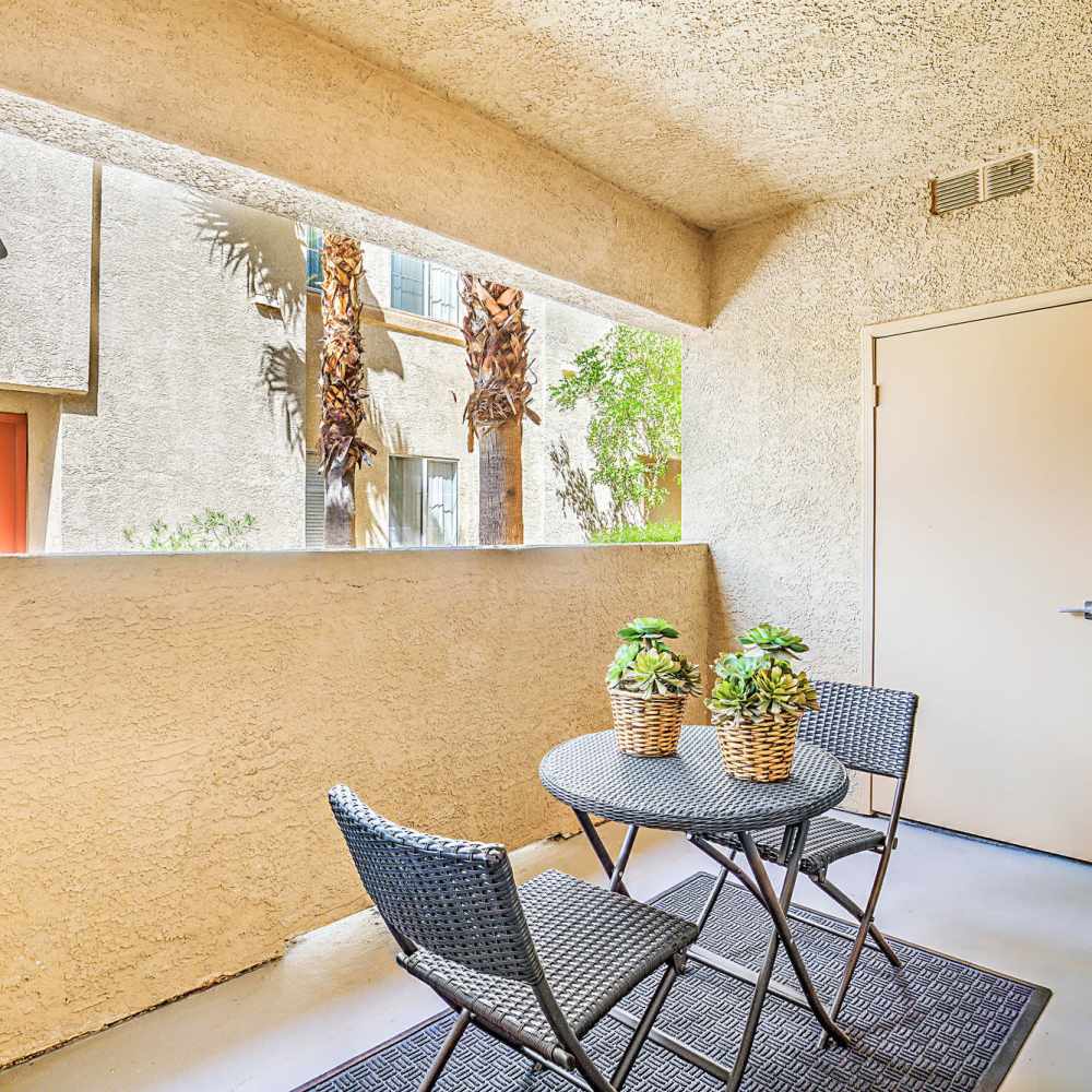 Patio with a table and chairs at Calypso Apartments in Las Vegas, Nevada