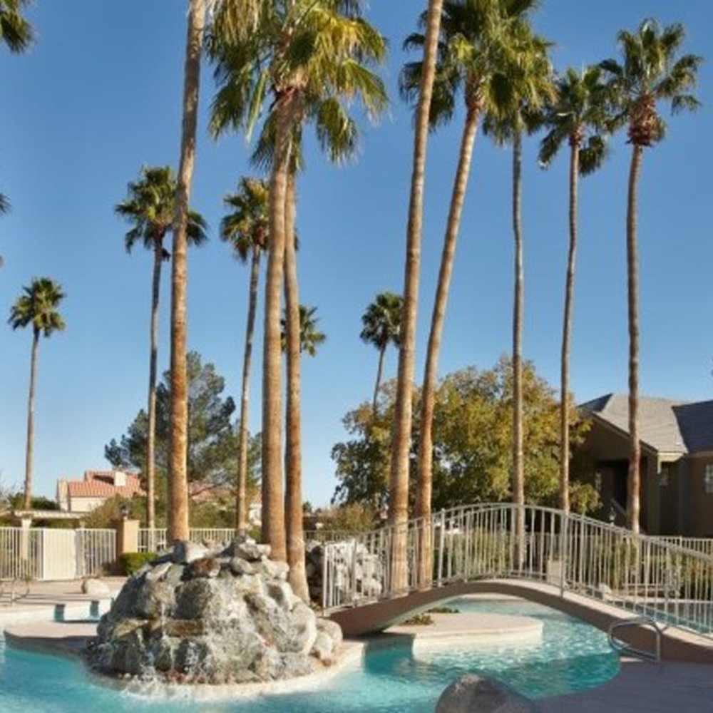 Swimming pool with water features at Calypso Apartments in Las Vegas, Nevada