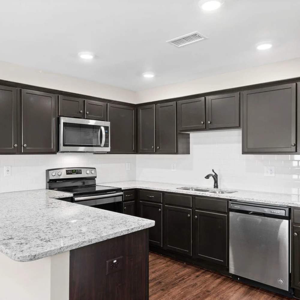 Modern kitchen with granite countertop  at Ashton Ridge At Westcreek in Clarksville, Tennessee