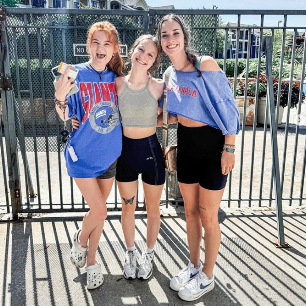Students posing near The Landing Lawrence in Lawrence, Kansas