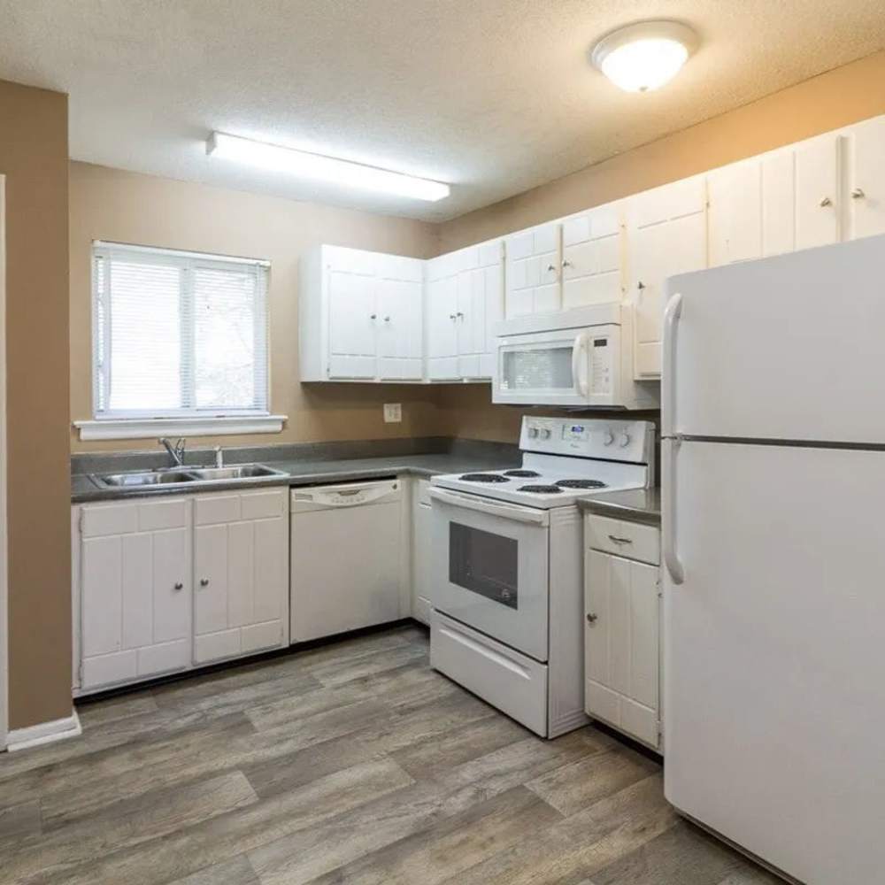Kitchen with white color cabinets at Willow Creek Apartments in Chattanooga, Tennessee
