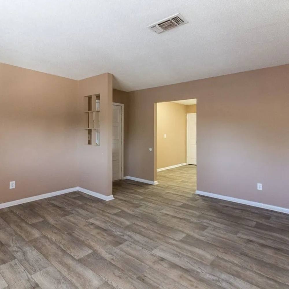 Living room with hardwood flooring at Willow Creek Apartments in Chattanooga, Tennessee
