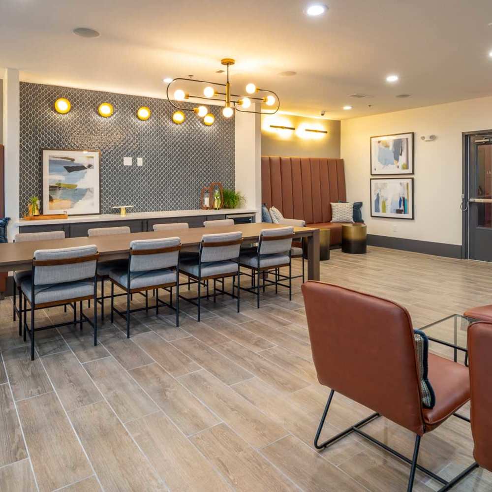 Community lounge with leather seating at 33Thirtythree in Houston, Texas