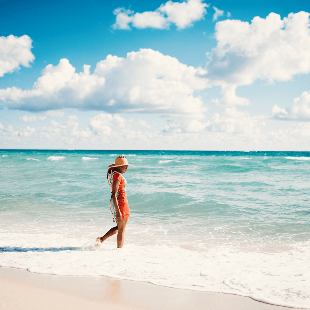 Woman walking in ocean at Solero at Plantation in Plantation, Florida