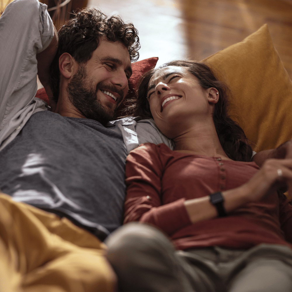 Couple laying down together in their home at Solero at Plantation in Plantation, Florida /apartments/fl/plantation/33/  