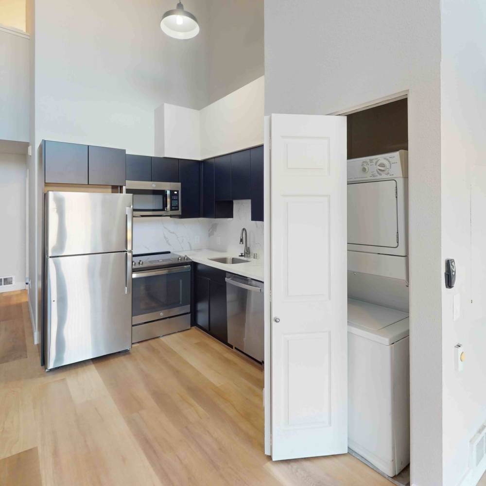 Kitchen with blue accents One55 Lofts in San Rafael, California