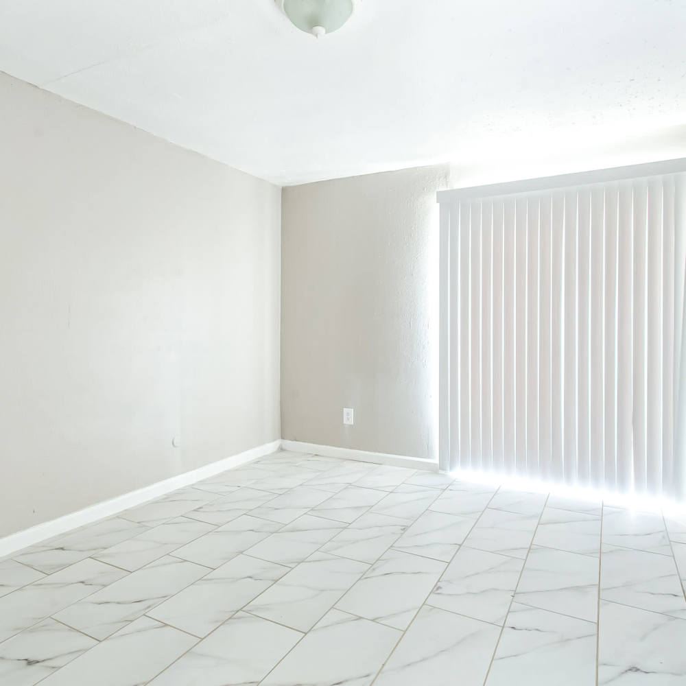 Living space with quick access to the patio or balcony at The Sanctuary At 9430 in Houston, Texas