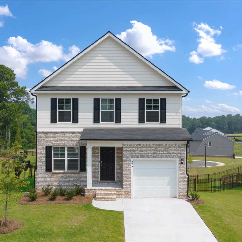 Home with an attached garage at The Lakes at Statham in Statham, Georgia