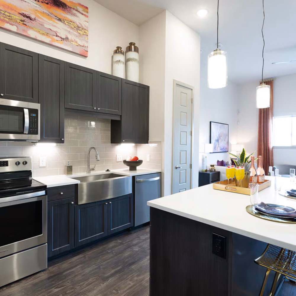 Kitchen area of an apartment home at Los Altos Trinity Green in Dallas, Texas