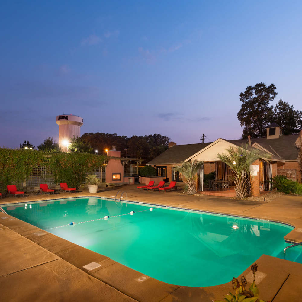 Swimming pool in front of the apartment building at The Arbors On Taylor in Montgomery, Alabama