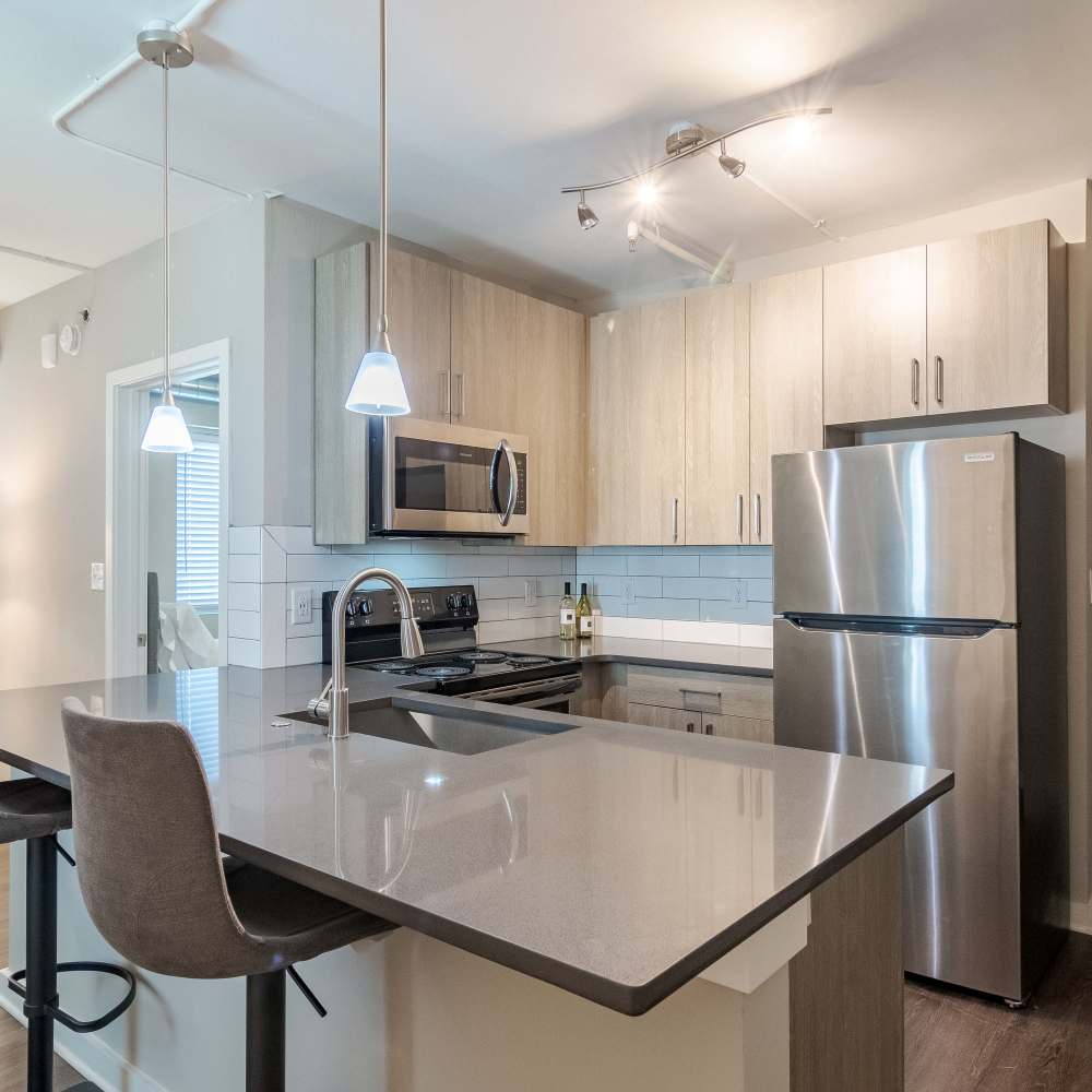 Modern model kitchen at The Lofts at Twenty25 in Atlanta, Georgia