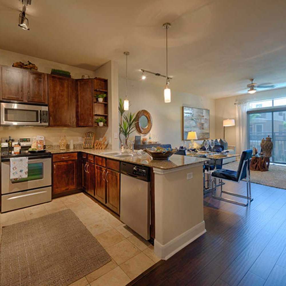 Apartment kitchen near the living room at Instrata Upper Kirby in Houston, Texas