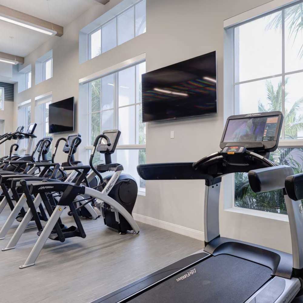 Community fitness center with cardio equipment at Sealofts At Boynton Village in Boynton Beach, Florida