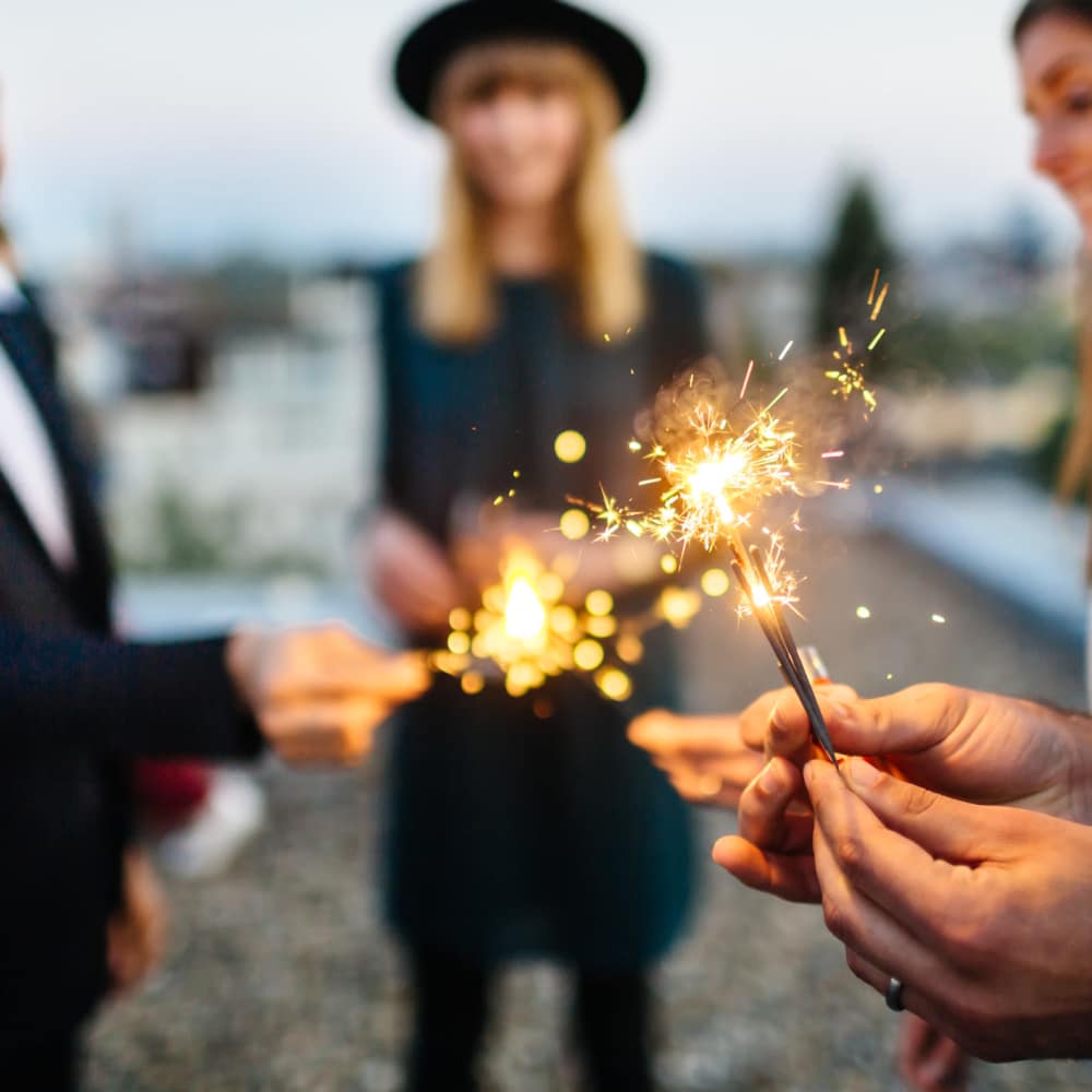 Friends celebrating with sparklers at Coral Wood Court in Reseda, California