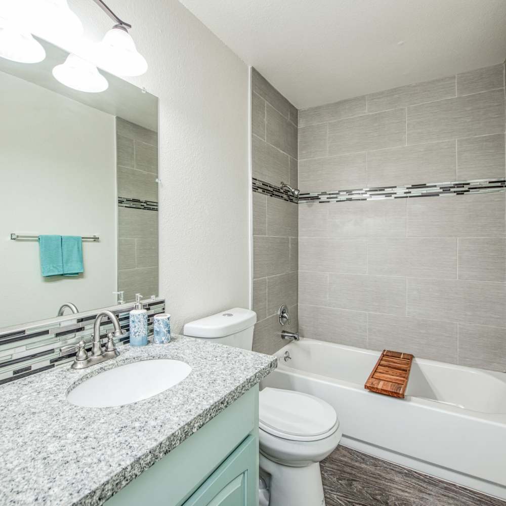 Well lit bathroom with tub and ambient lighting at The Landing at Fancher Creek in Fresno, California, 