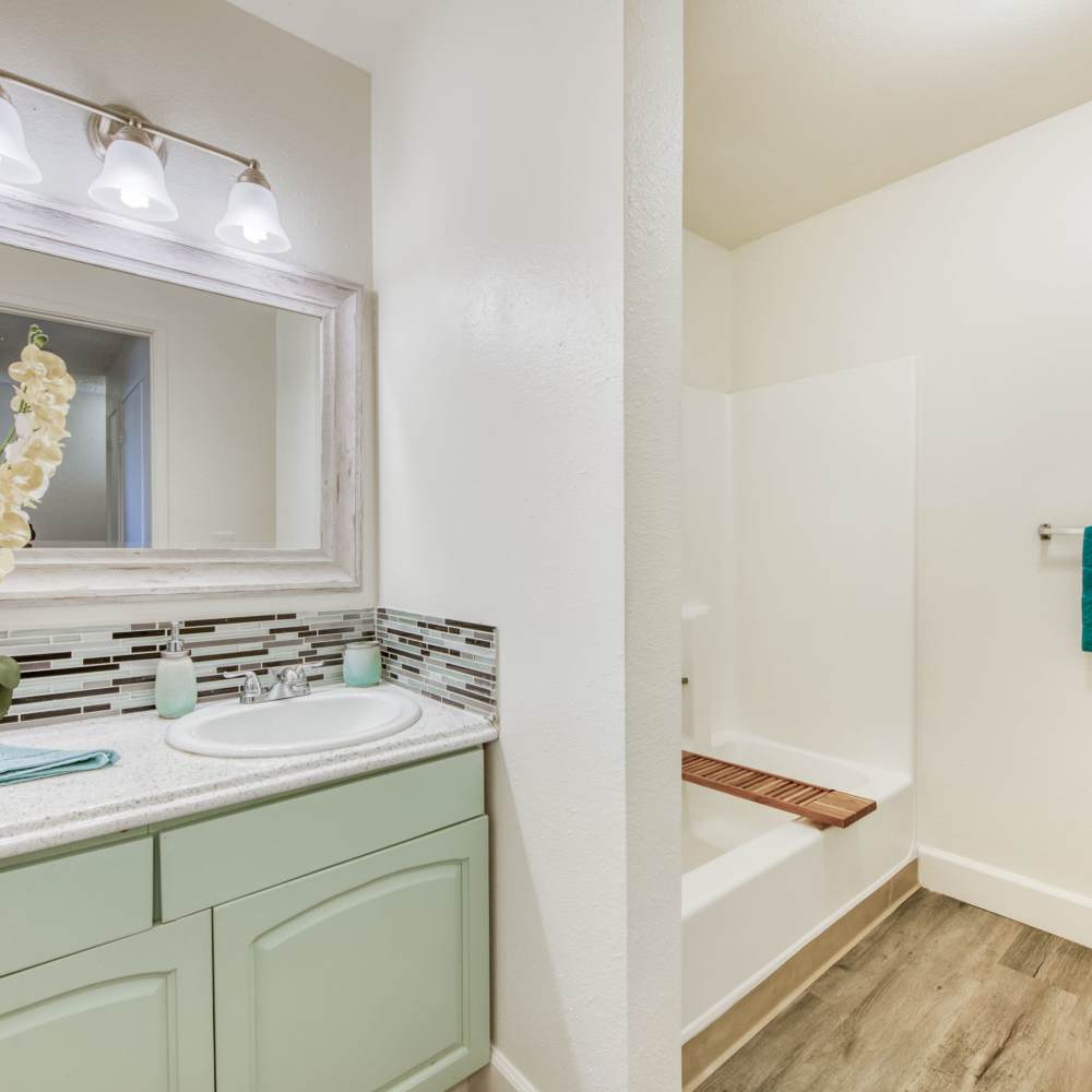 Bright bathroom with shower and tub at The Landing at Fancher Creek in Fresno, California, 
