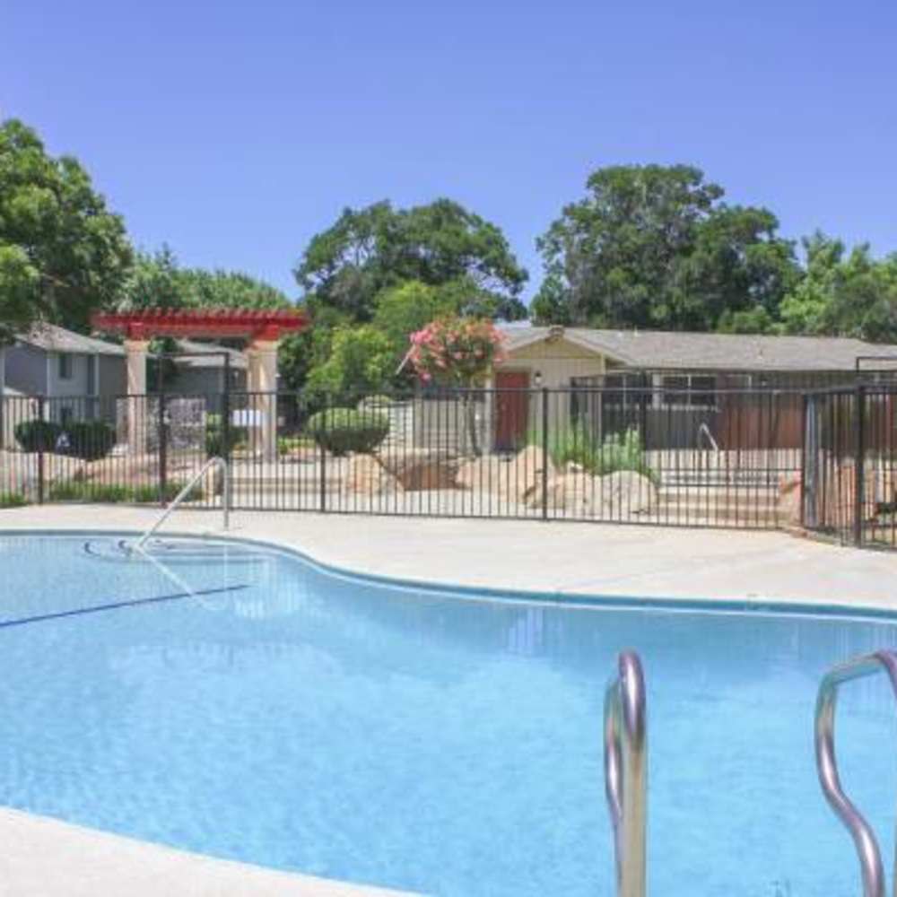 Pool area with lounge seating at The Landing at Fancher Creek in Fresno, California, 