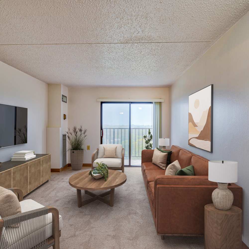 living space with sliding glass door leading to private balcony at Towne Centre Place in Ypsilanti, Michigan