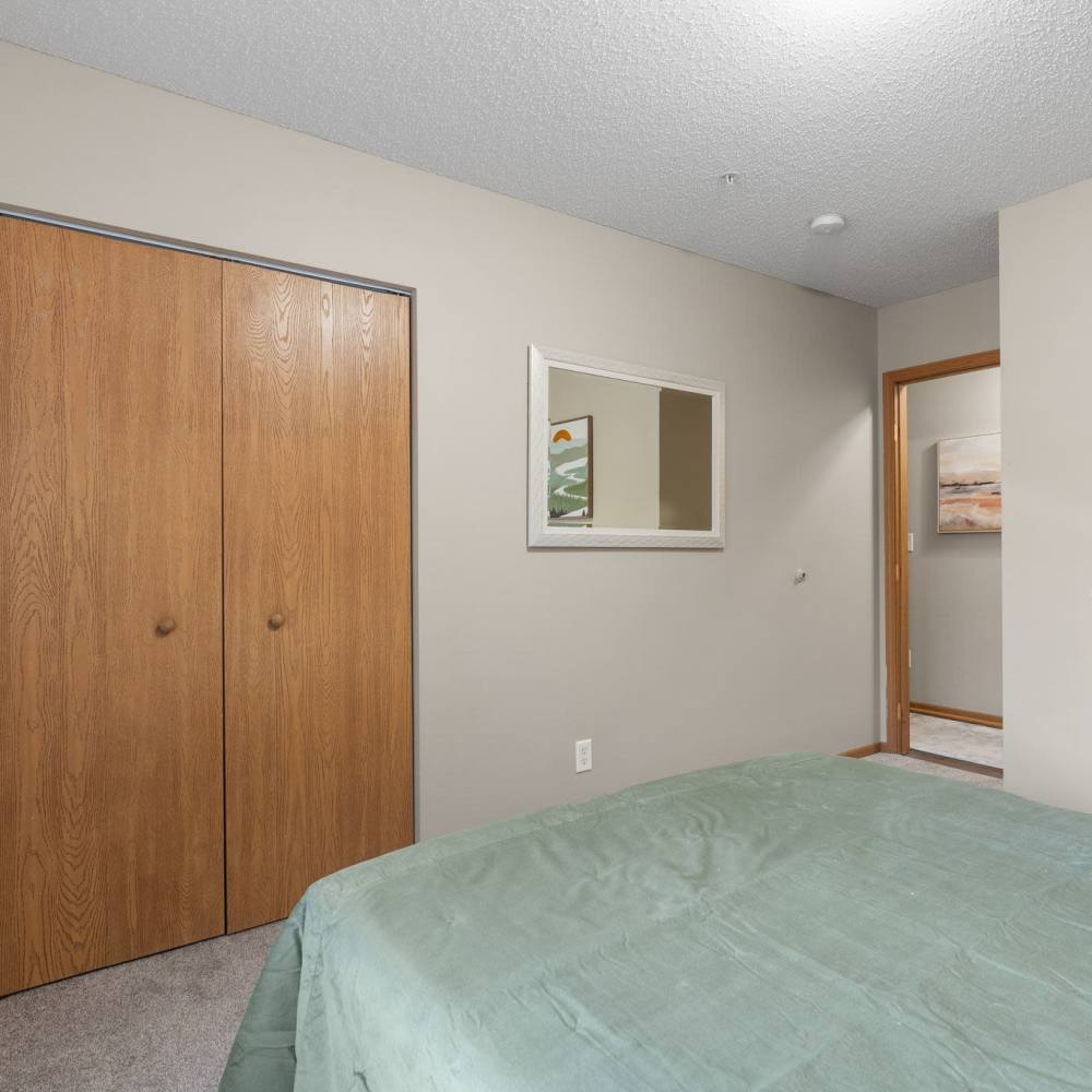 Bedroom with walk-in closet at Granite Peaks in Minneapolis, Minnesota