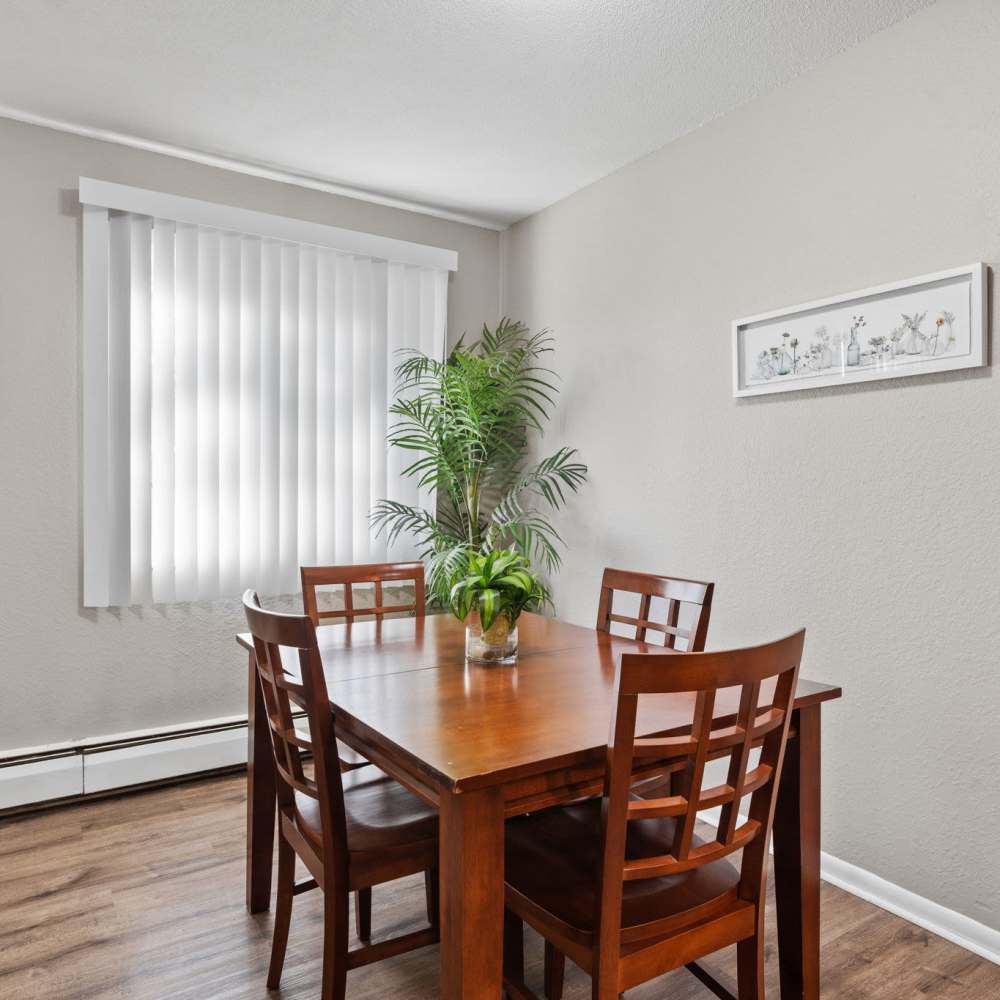 Dining area with large window at Granite Ridge in Brooklyn Park, Minnesota