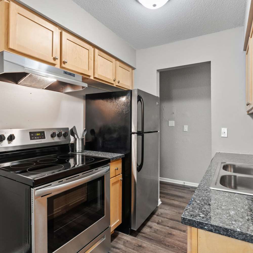 Kitchen with stainless steel appliance at Granite Ridge in Brooklyn Park, Minnesota