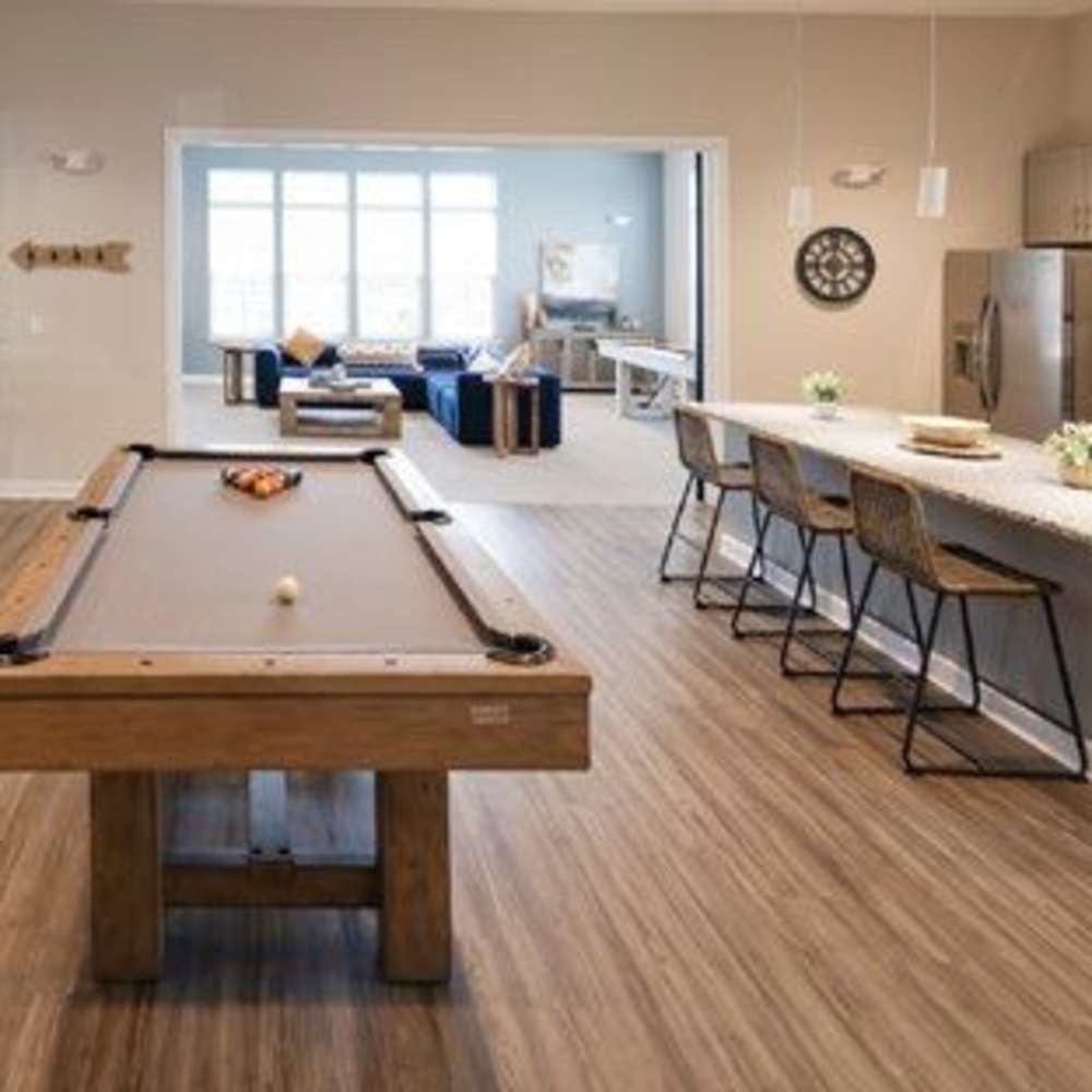 Recreational room with a pool table, kitchen area and seating space at Commonwealth Apartments in Midlothian, Virginia