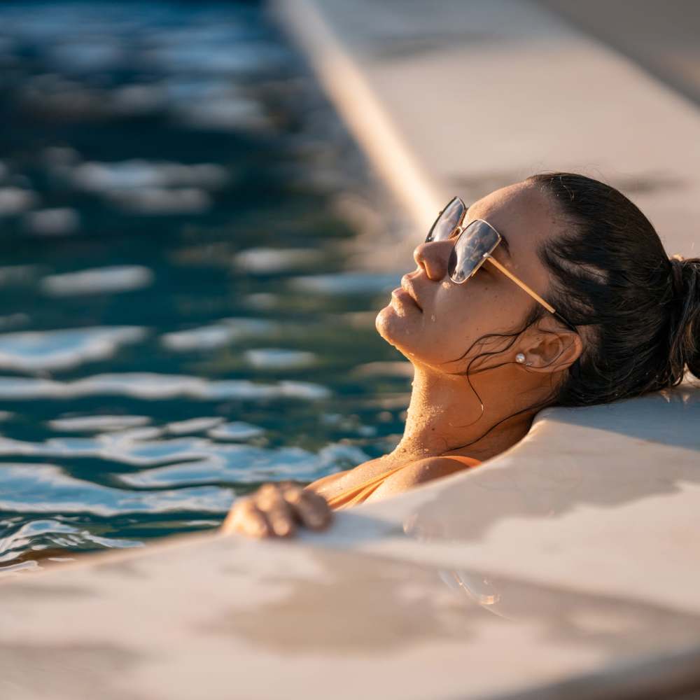 Resident enjoying in the pool at Arbors at the Reservoir in Ridgeland, Mississippi, 