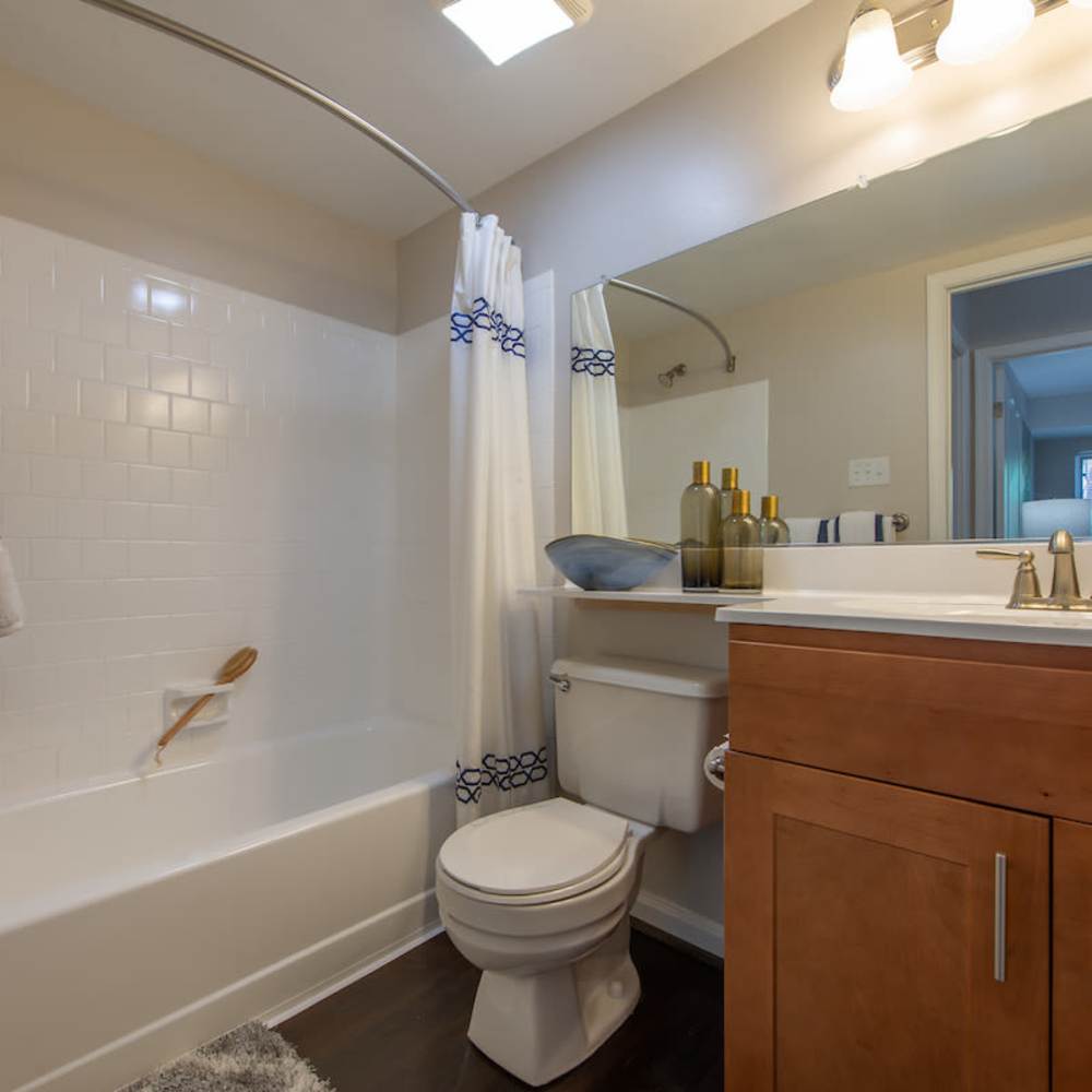 Bathroom with vanity mirror at The Elms at Old Mill in Millersville, Maryland 
