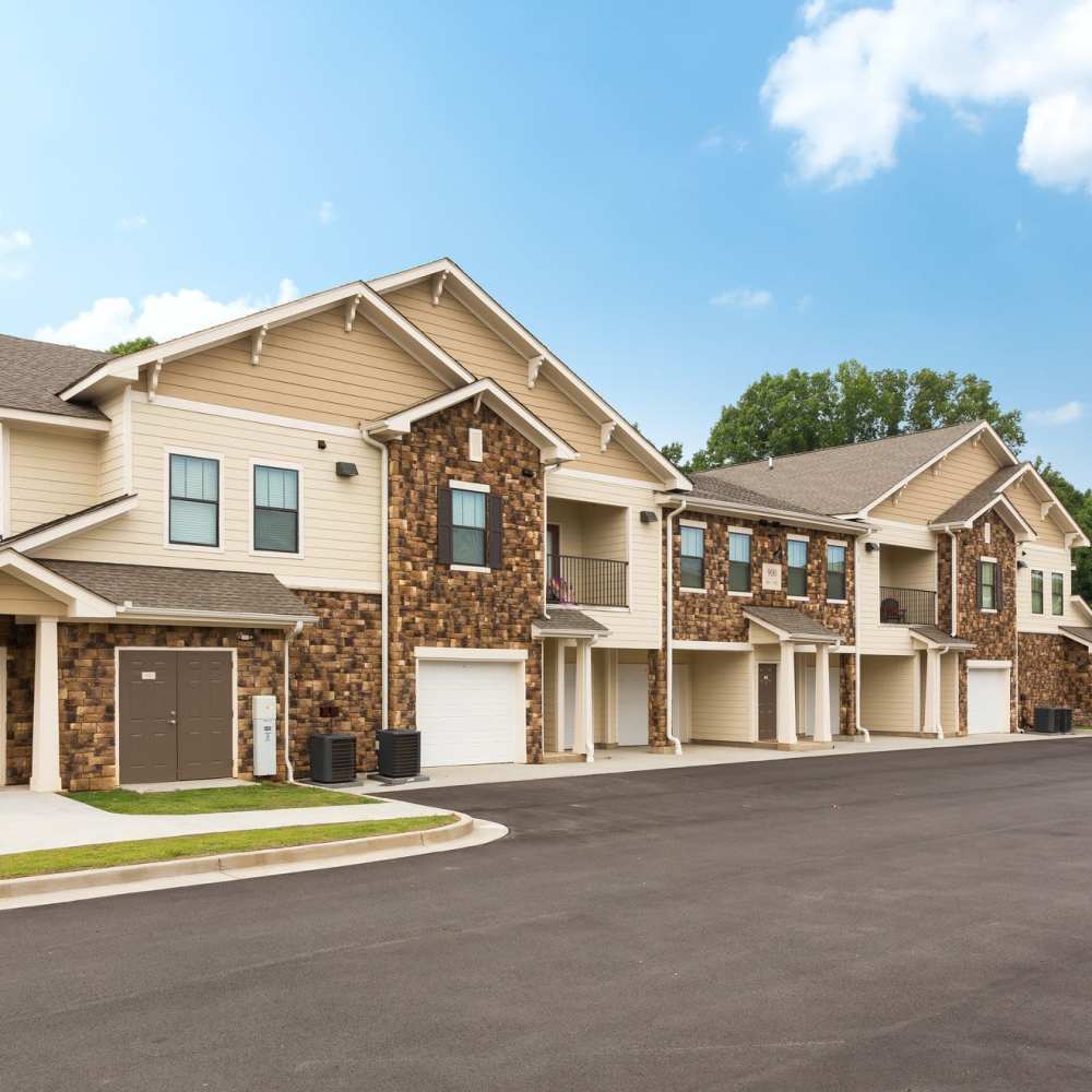 Exterior of the property with wide road in the front at Terraces at Suwanee Gateway in Suwanee,Georgia