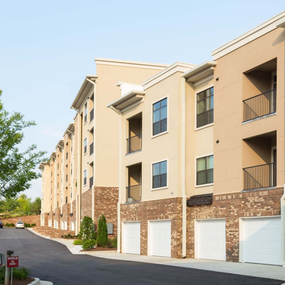 Property exterior with individual garages at Terraces at Suwanee Gateway in Suwanee,Georgia
