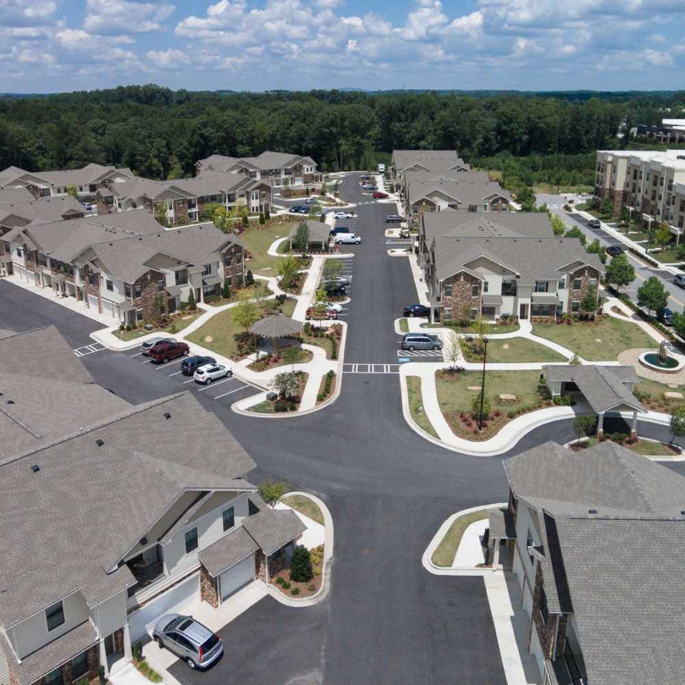 Aerial shot displaying the buildings and parking spaces at Terraces at Suwanee Gateway in Suwanee,Georgia