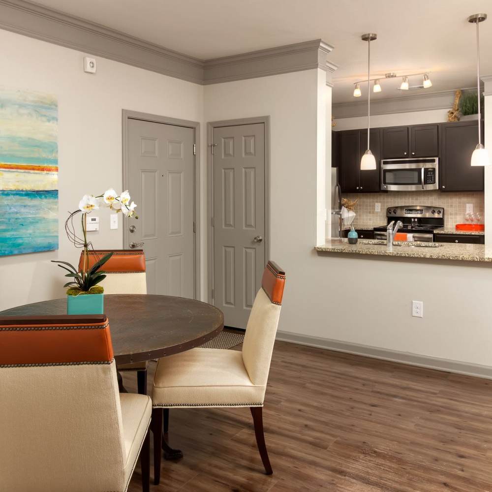 Dining area and kitchen in the back at Terraces at Suwanee Gateway in Suwanee,Georgia