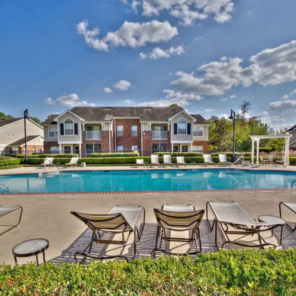 Resident swimming pool with lounge beds at Arbors at the Reservoir in Ridgeland, Mississippi, 