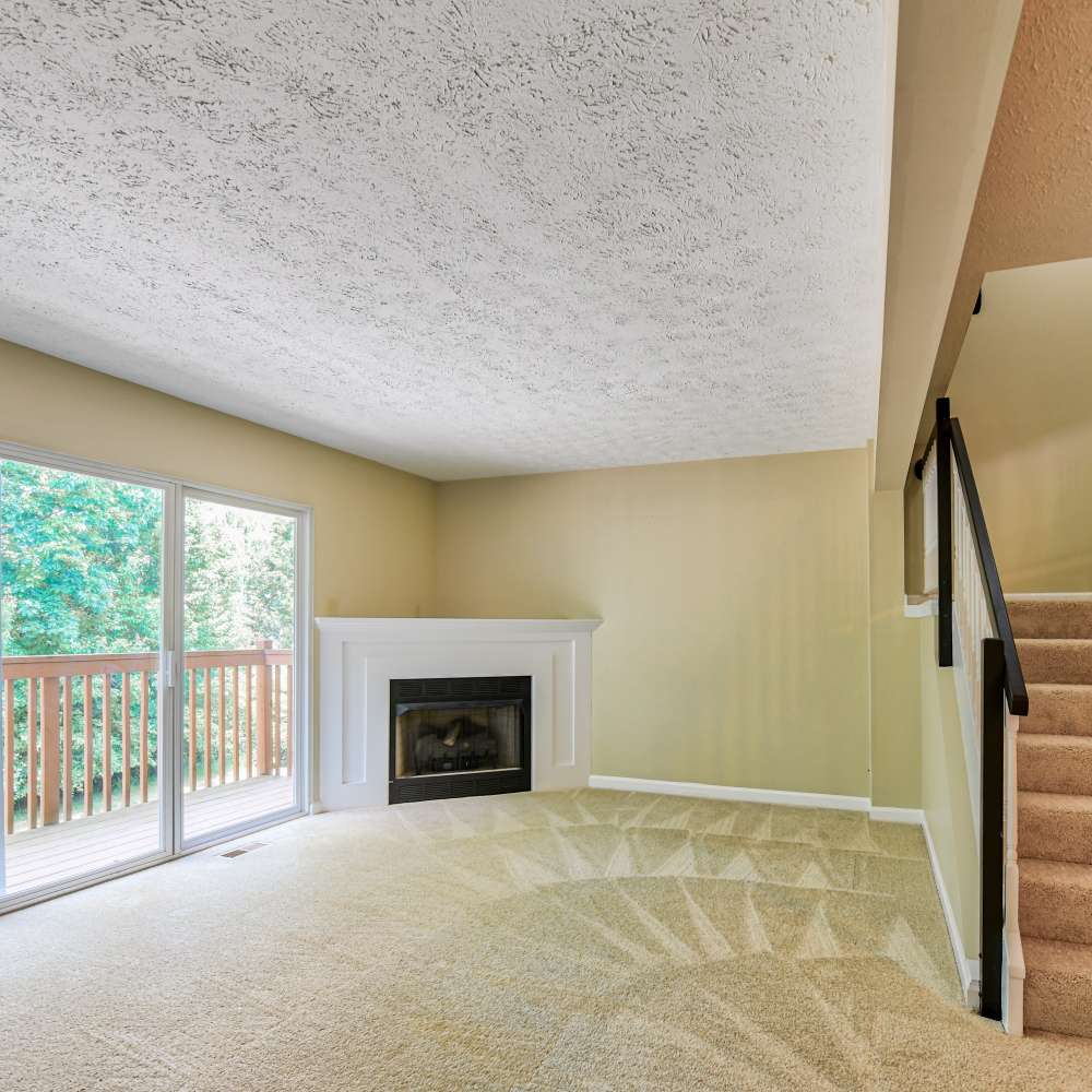Living room with stairs leading to the above floor at Hawthorne Estates, Oakdale, Pennsylvania