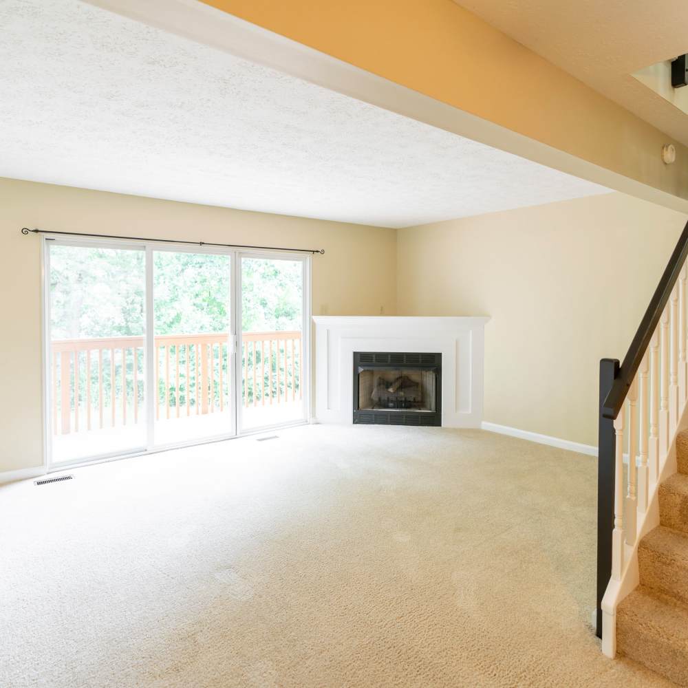 Well-lit living room with a firepit at Hawthorne Estates, Oakdale, Pennsylvania