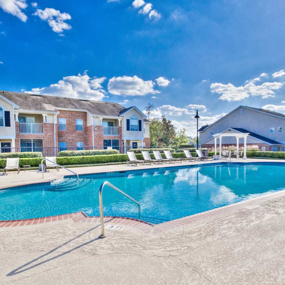 Swimming pool with lounge beds at Arbors at the Reservoir in Ridgeland, Mississippi, 