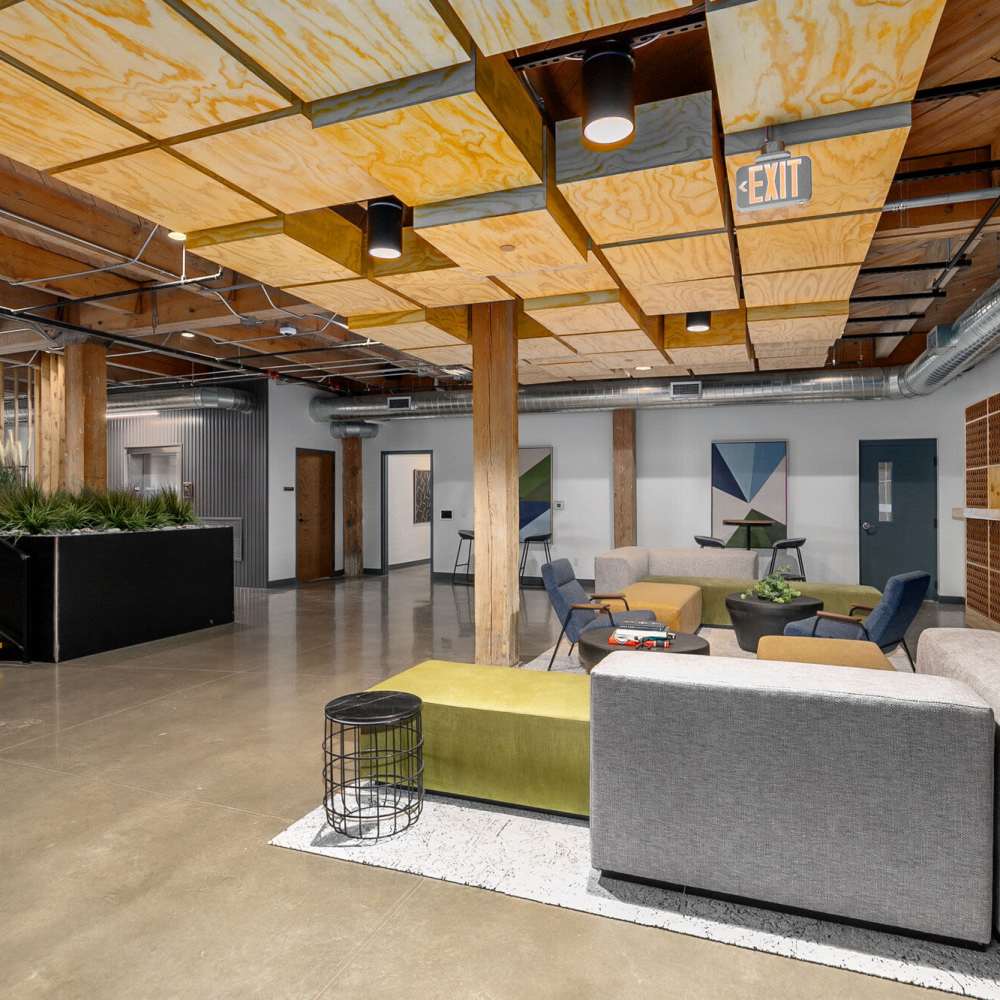 Clubhouse with lounge seating and flat screen television at Box Board Lofts in Grand Rapids, Michigan