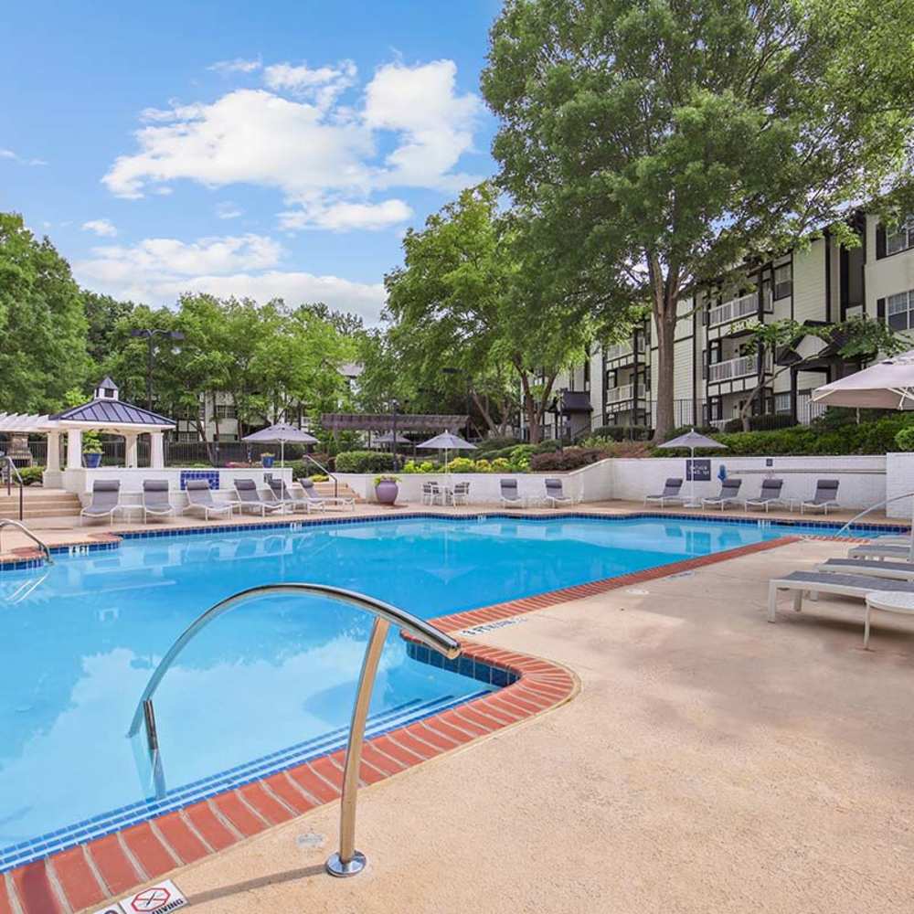 Swimming pool with lounge chairs at Grande Oaks in Roswell, Georgia 