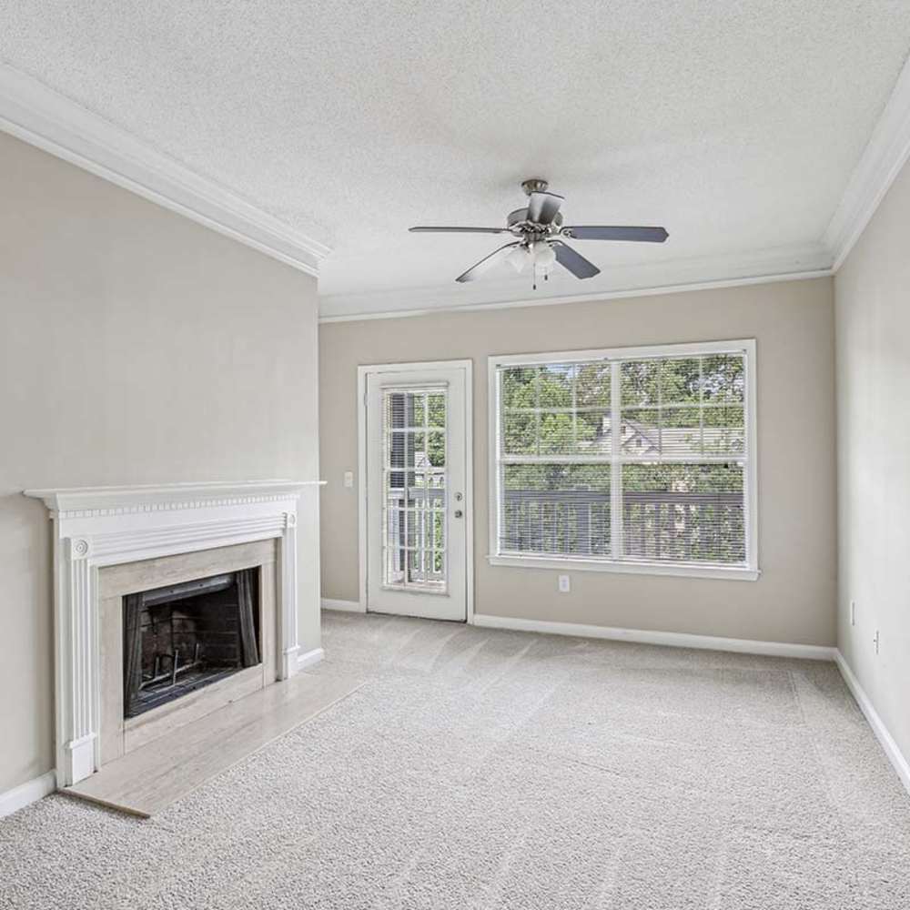 Unfurnished living room with ceiling fan at Grande Oaks in Roswell, Georgia 