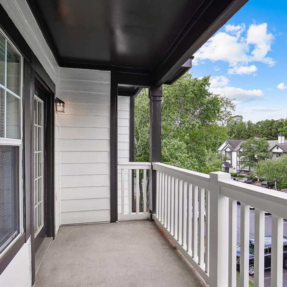 Private patio with wooden railing at Grande Oaks in Roswell, Georgia 