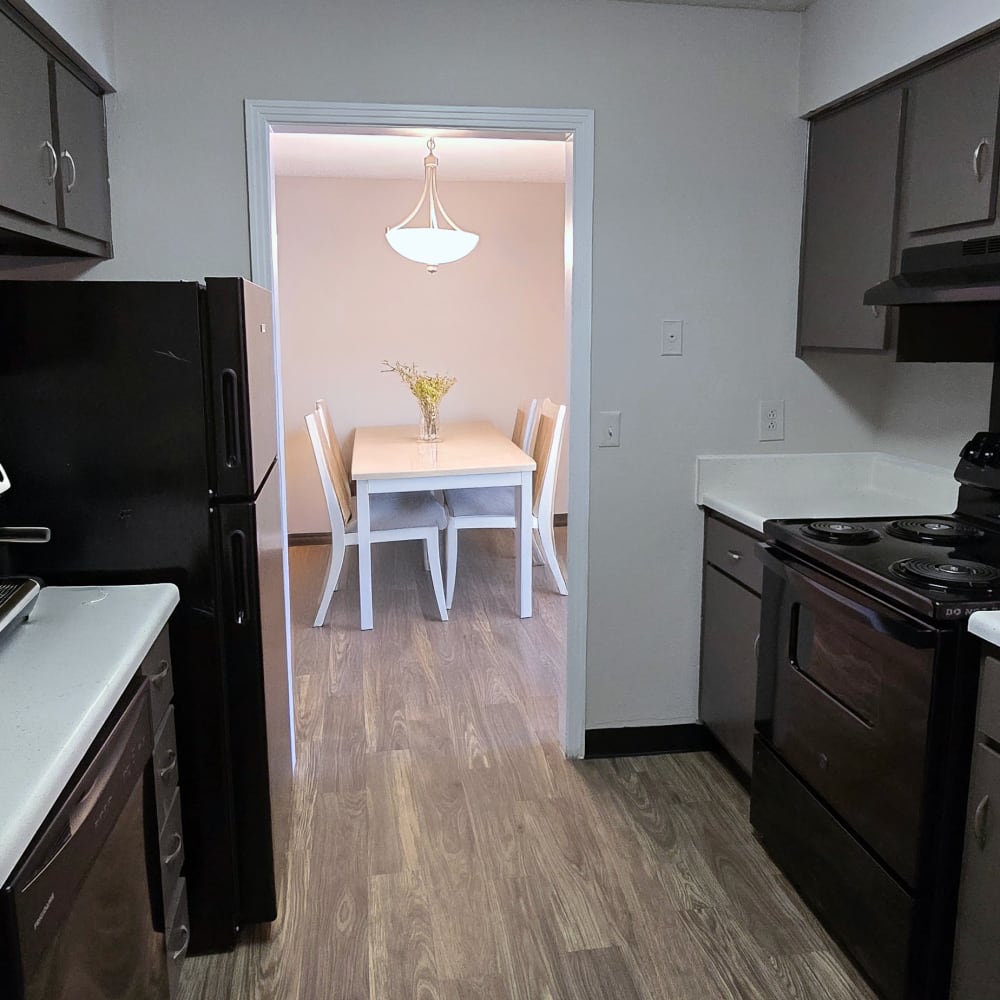 Kitchen with black appliances at Dominion House Apartments in Nashville, Tennessee