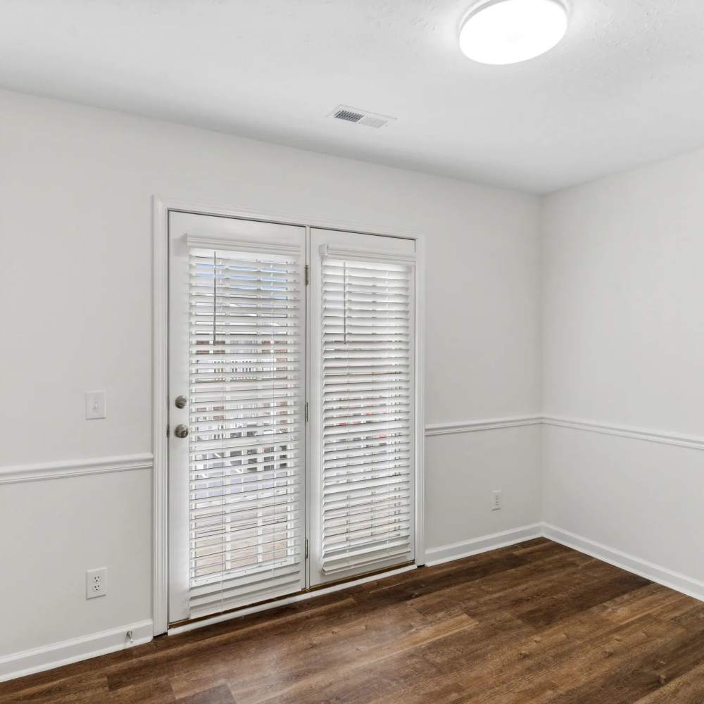 Doors out to a private patio at The Bellevue At 1045 in Cookeville, Tennessee