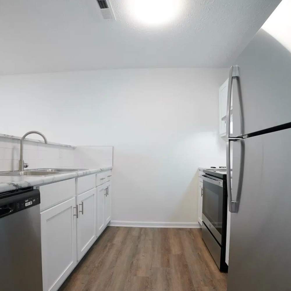 Kitchen with stainless-steel appliances in a home at The Bellevue At 1045 in Cookeville, Tennessee