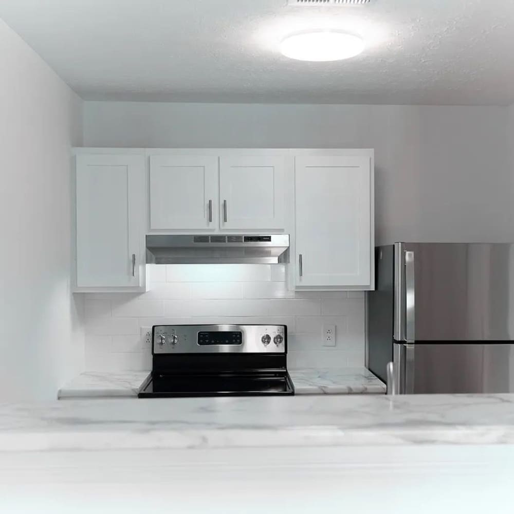 Stainless-steel fridge in an apartment at The Bellevue At 1045 in Cookeville, Tennessee