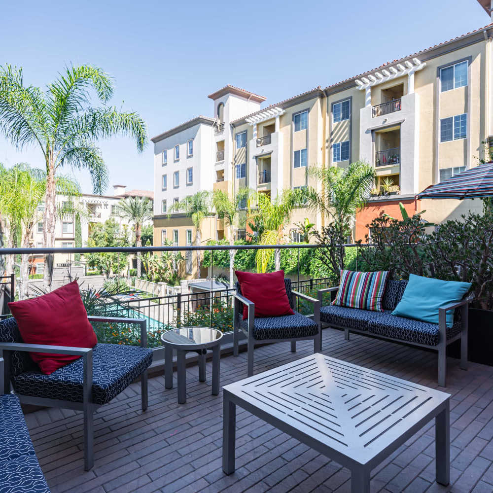 Seating are near pool at The Boulevard Apartment Homes in Woodland Hills, California