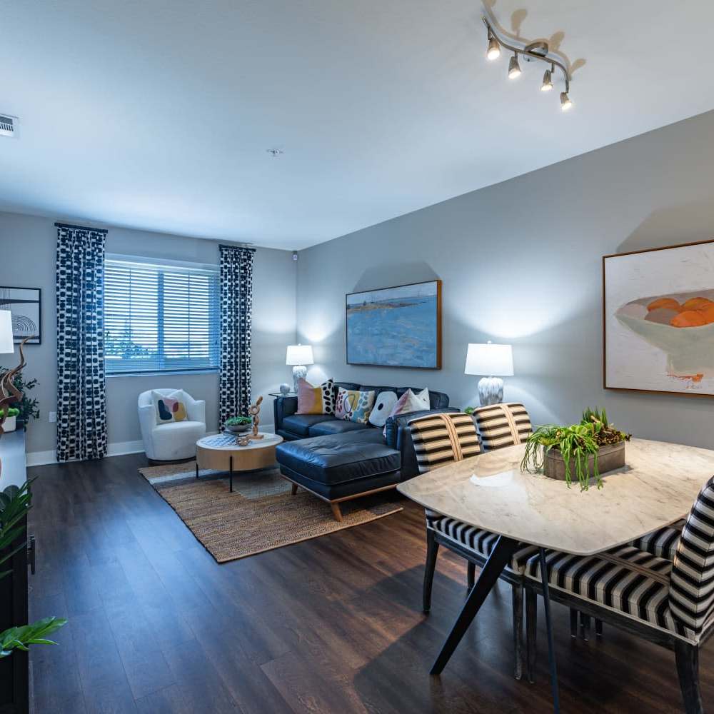 Living room with wooden flooring at The Boulevard Apartment Homes in Woodland Hills, California