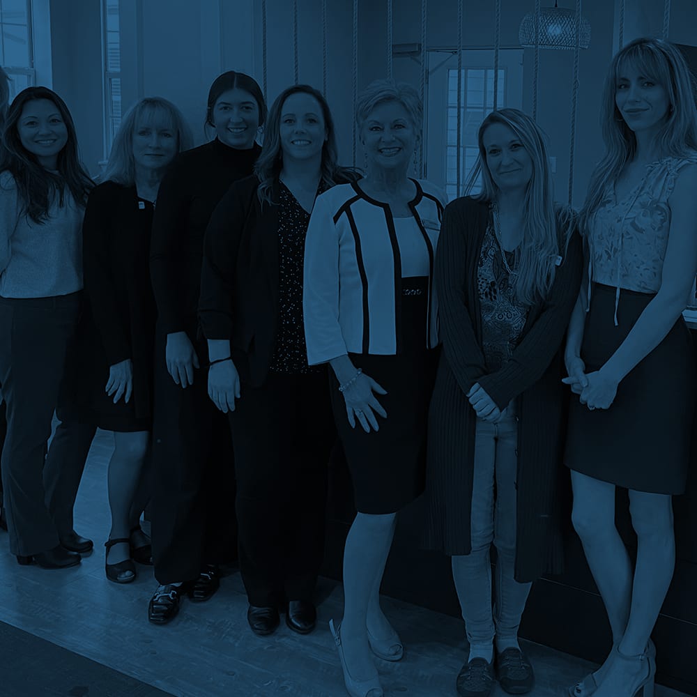 Group of employees gathered for a photo at Drucker + Falk in Newport News, Virginia